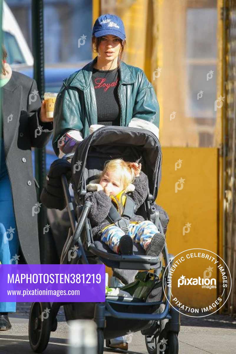 Emily Ratajkowski is seen out for a walk pushing her son in a stroller and picking up a coffee in NYC