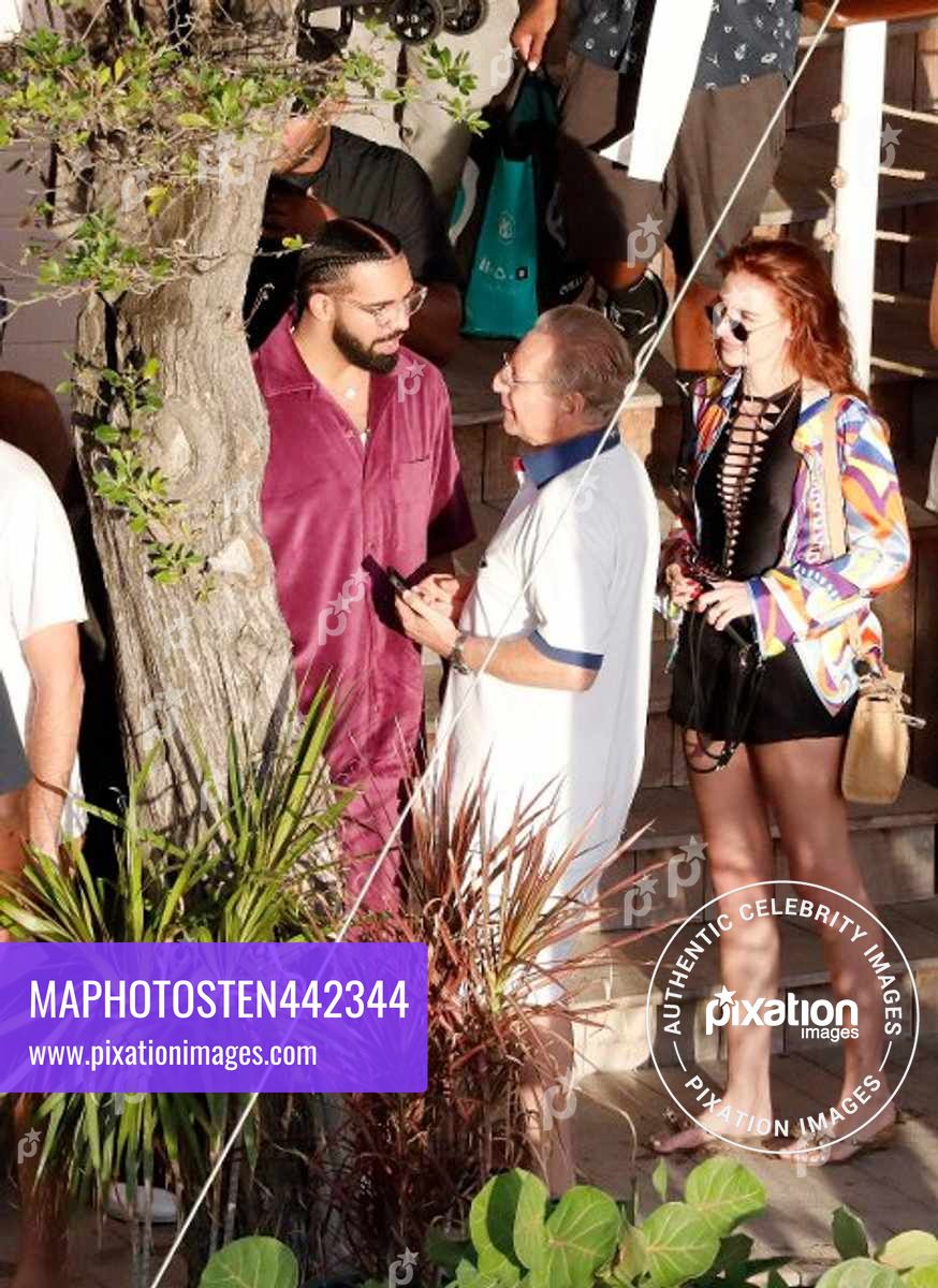 Canadian rapper Drake is seen enjoying lunch while at the Caribbean beach "Shellona" in St Barts