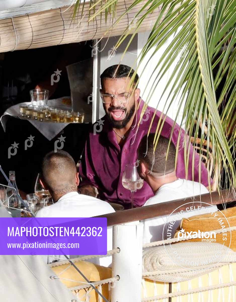 Canadian rapper Drake is seen enjoying lunch while at the Caribbean beach "Shellona" in St Barts