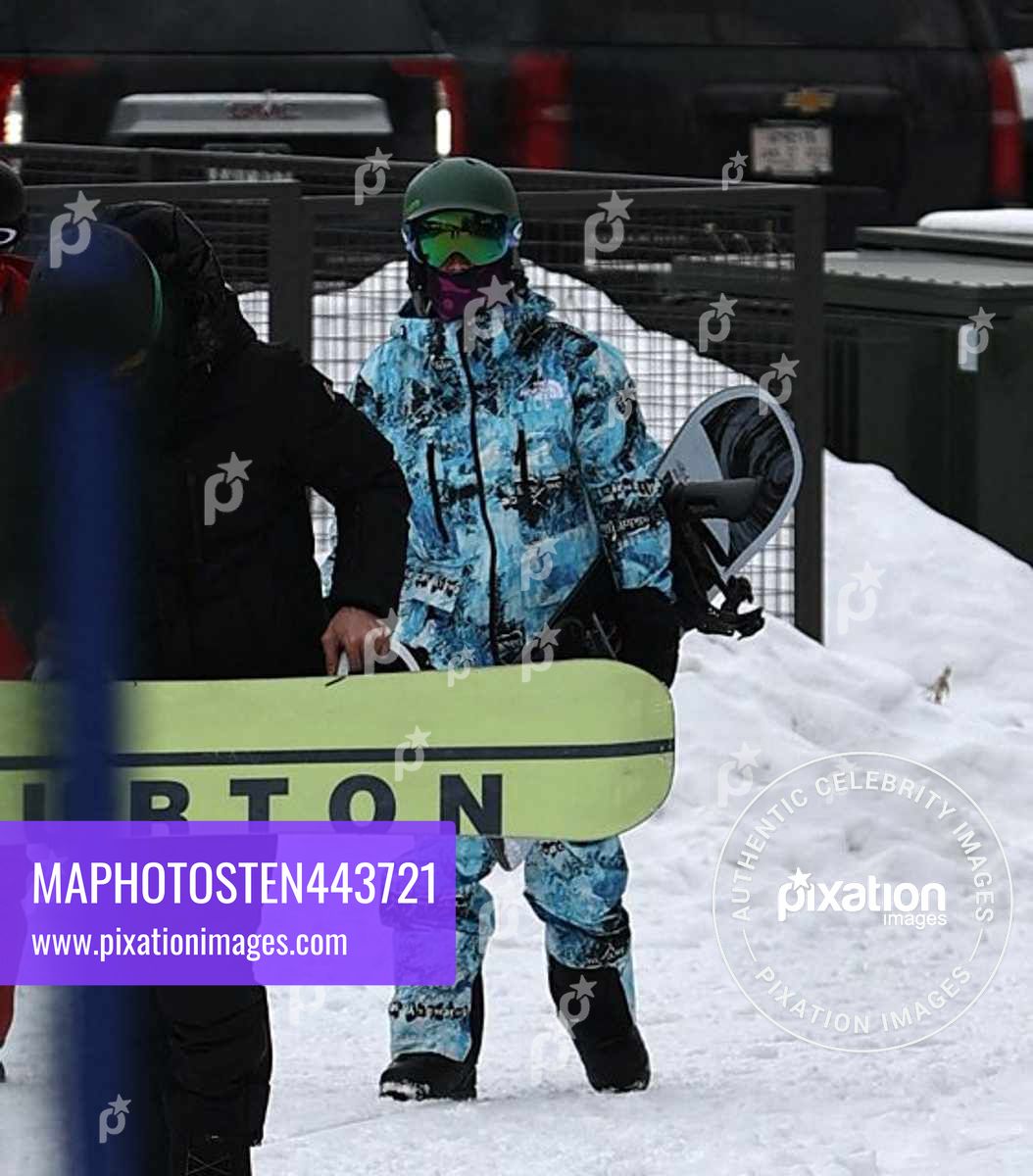 Justin Bieber dressed in all blue camouflage arrives at Buttermilk Mountain to go snow boarding with friends in Aspen, Colorado