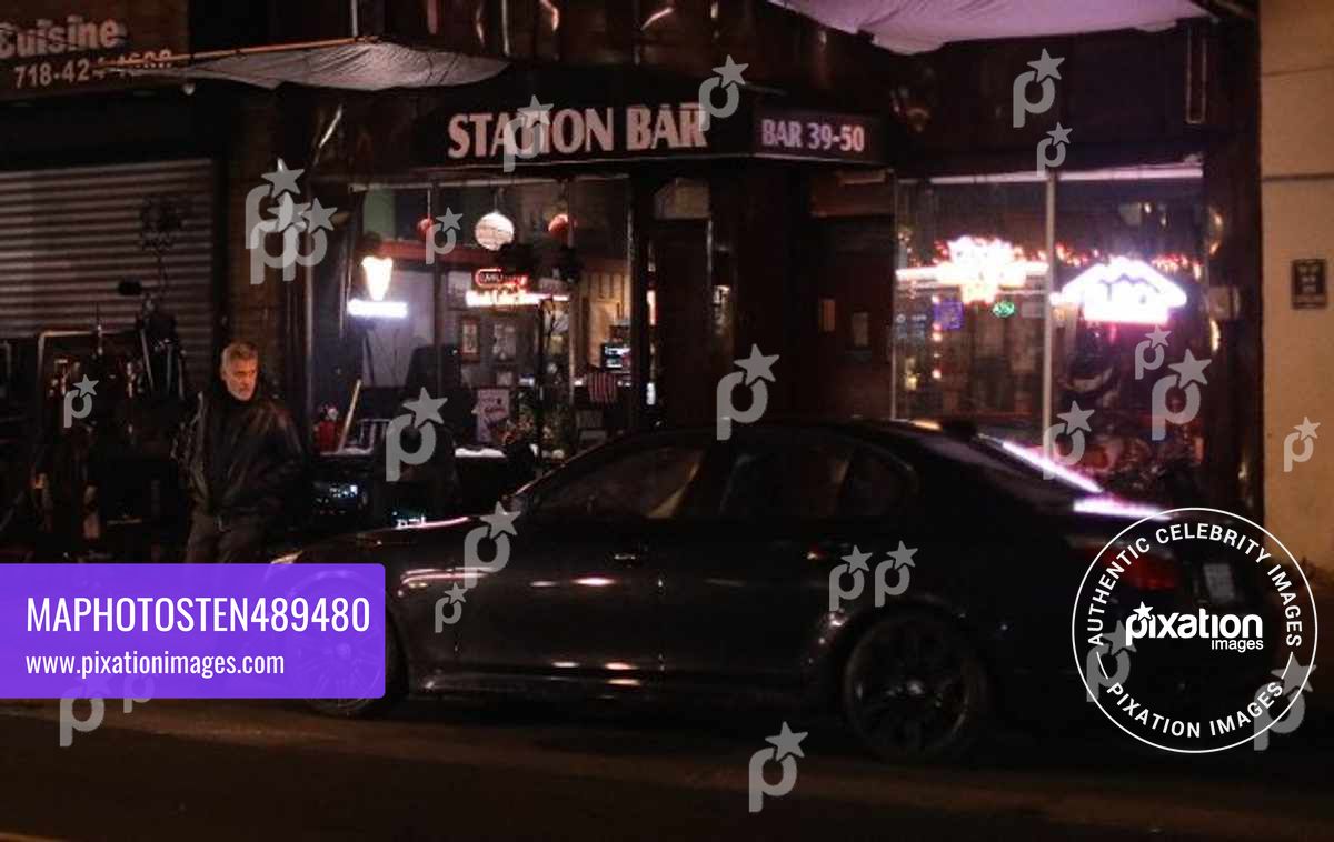George Clooney leaves a dive bar and drives in a car while making facial expressions on the first day of filming his Apple TV movie at 4:30am in NYC