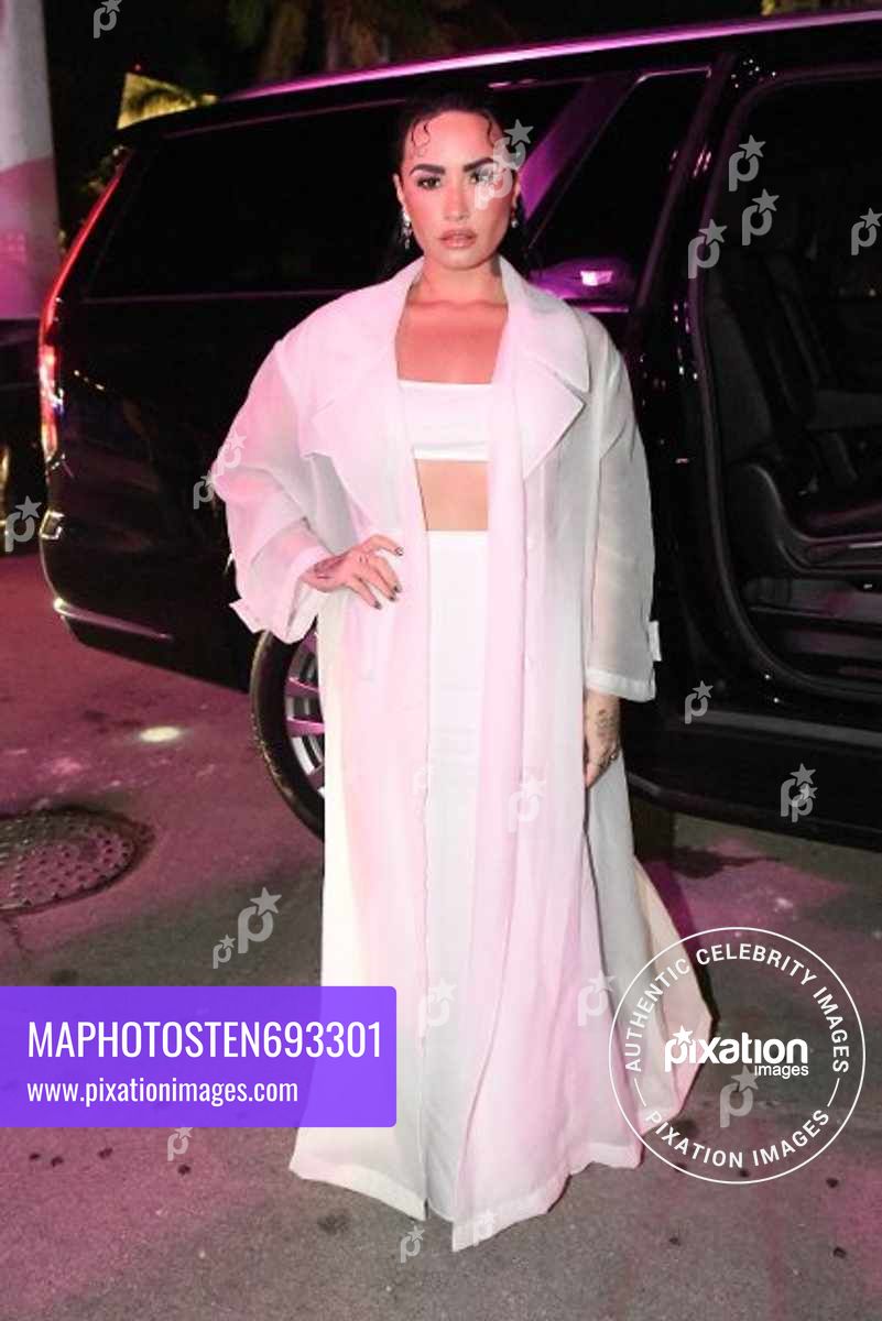 Demi Lovato arrives, along with other celebrities, to the Hugo Boss fashion show in Miami