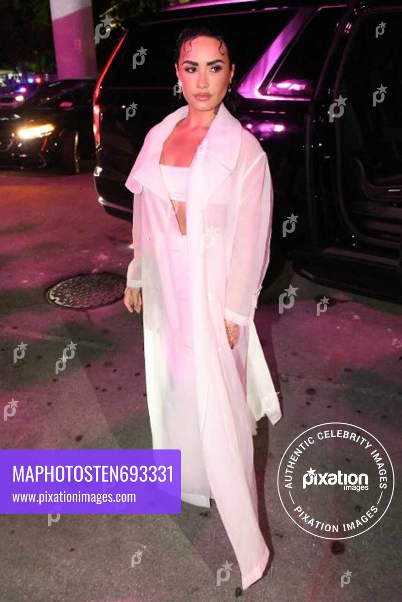 Demi Lovato arrives, along with other celebrities, to the Hugo Boss fashion show in Miami