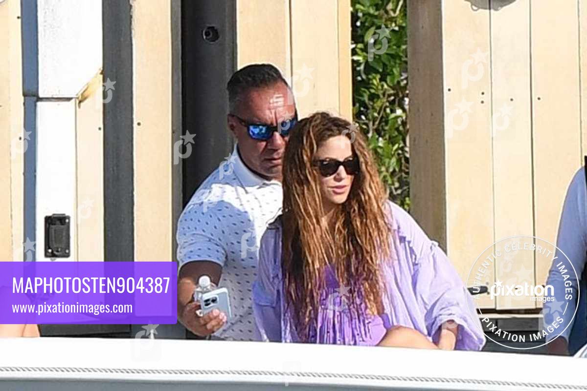After mingling with Tom Cruise over F1 Weekend, Shakira looks happy as she takes an afternoon cruise with friends including F1 star Lewis Hamilton in Miami