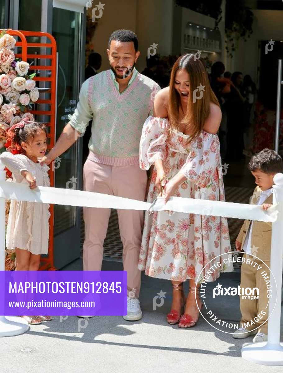 Chrissy Teigen and family attend ribbon cutting ceremony for her new Cravings Bakery Shop