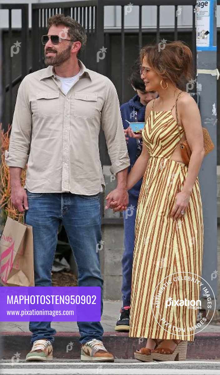 Ben Affleck and Jennifer Lopez share a kiss as they shop in Los Angeles