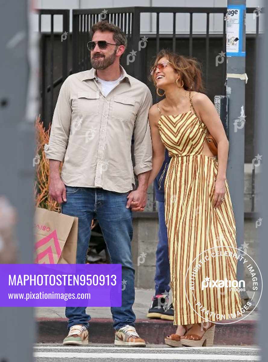 Ben Affleck and Jennifer Lopez share a kiss as they shop in Los Angeles