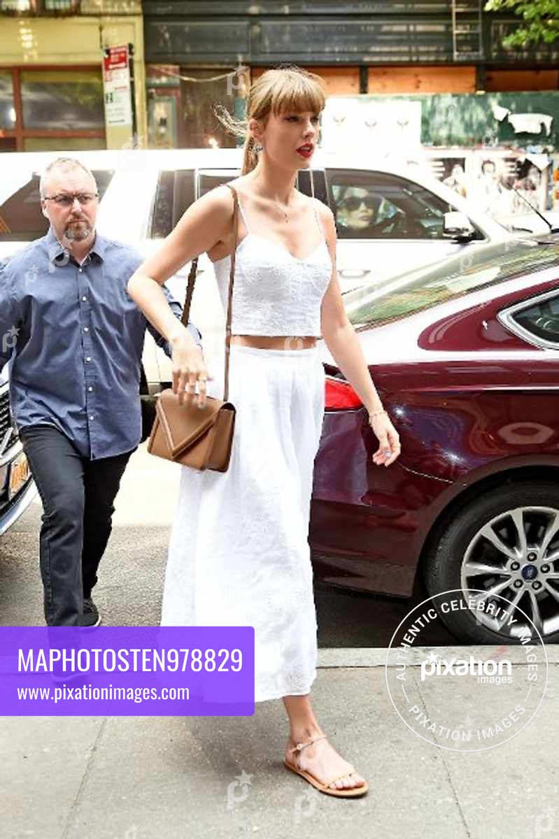 Taylor Swift looks angelic in a white crop top and a skirt while arriving to the Electric Lady recording studio